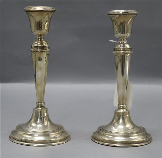 A pair of George V silver candlesticks by William Hutton & Sons, 21.2cm.